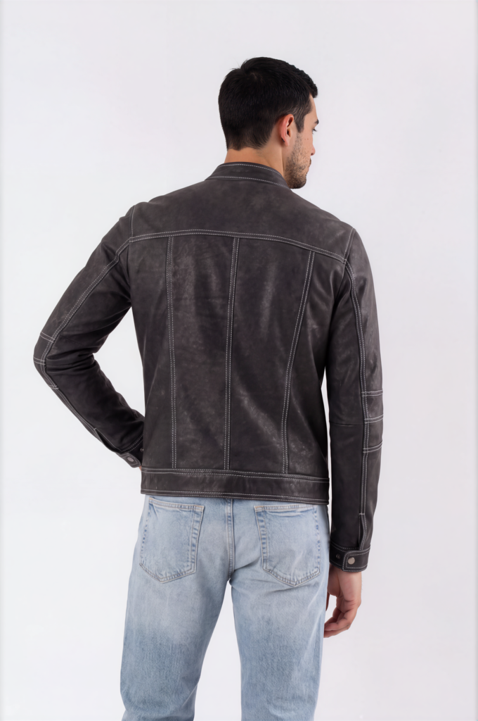 Close-up of a distressed brown leather biker jacket showing rich patina